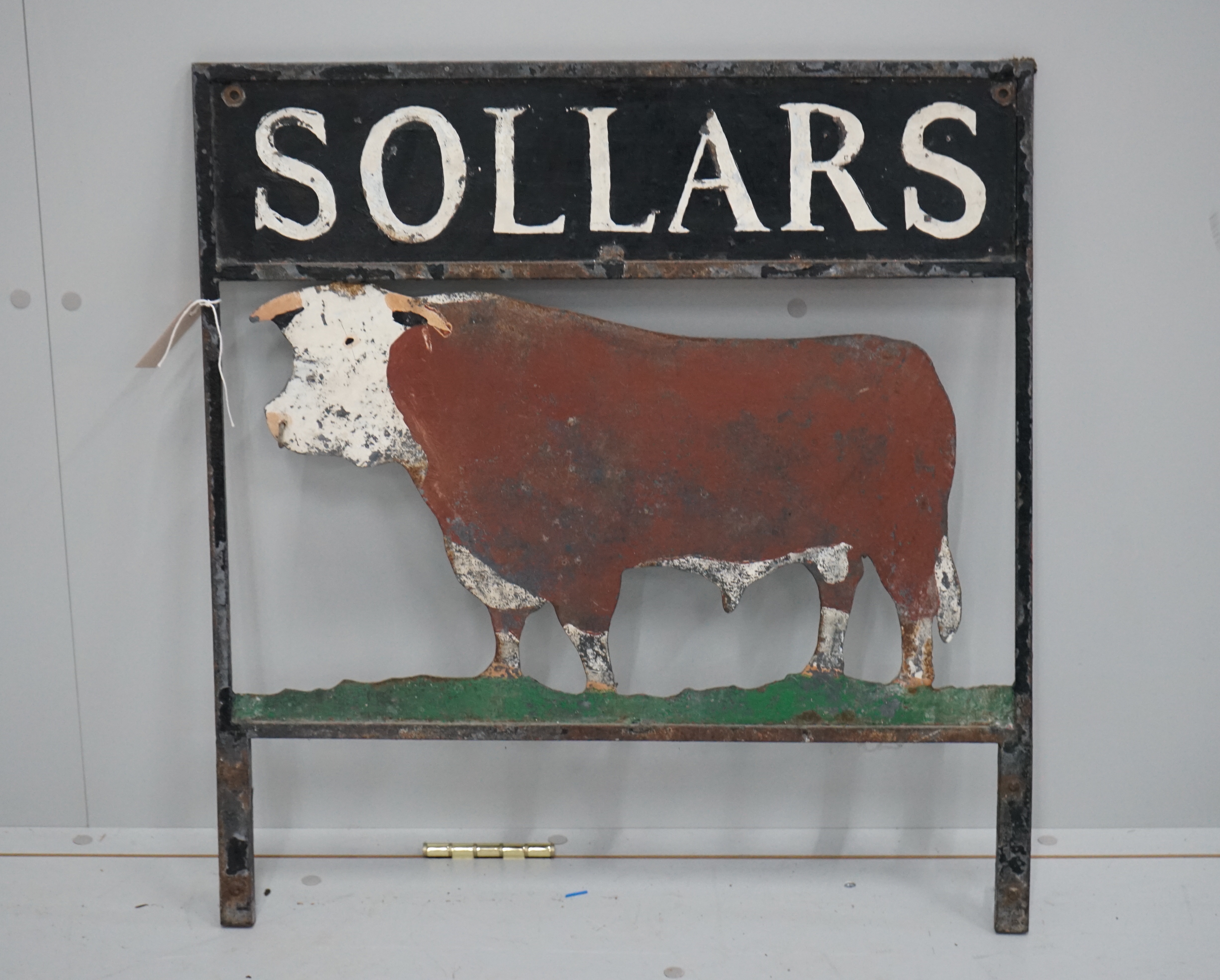 A vintage painted metal sign, 'Sollars', width 64cm, height 53cm